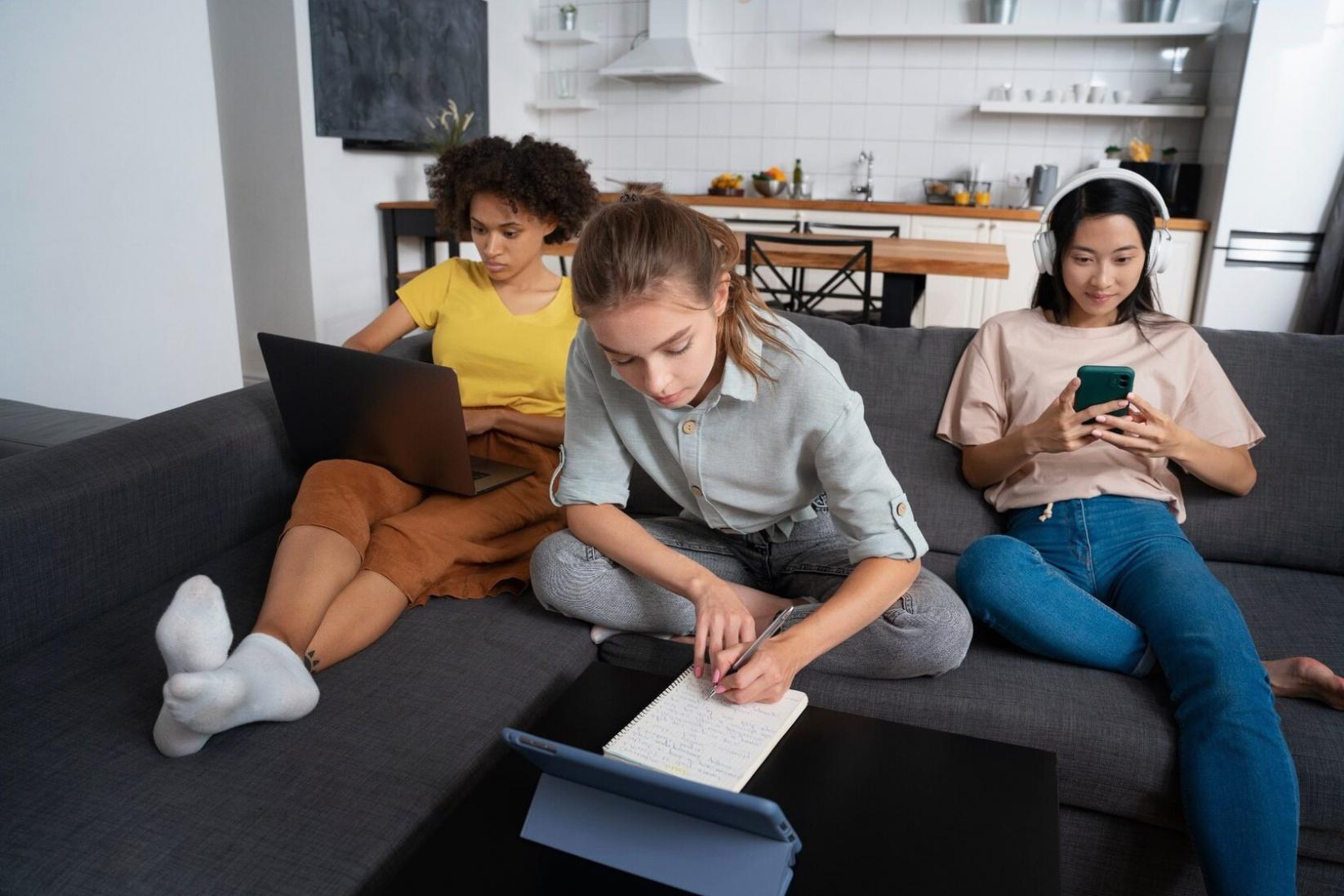 Financial data analysis workspace with multiple screens showing market charts and economic indicators